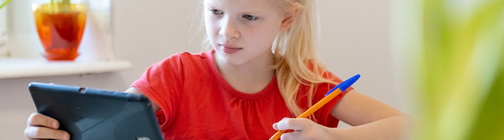 the girl is studying with tablet