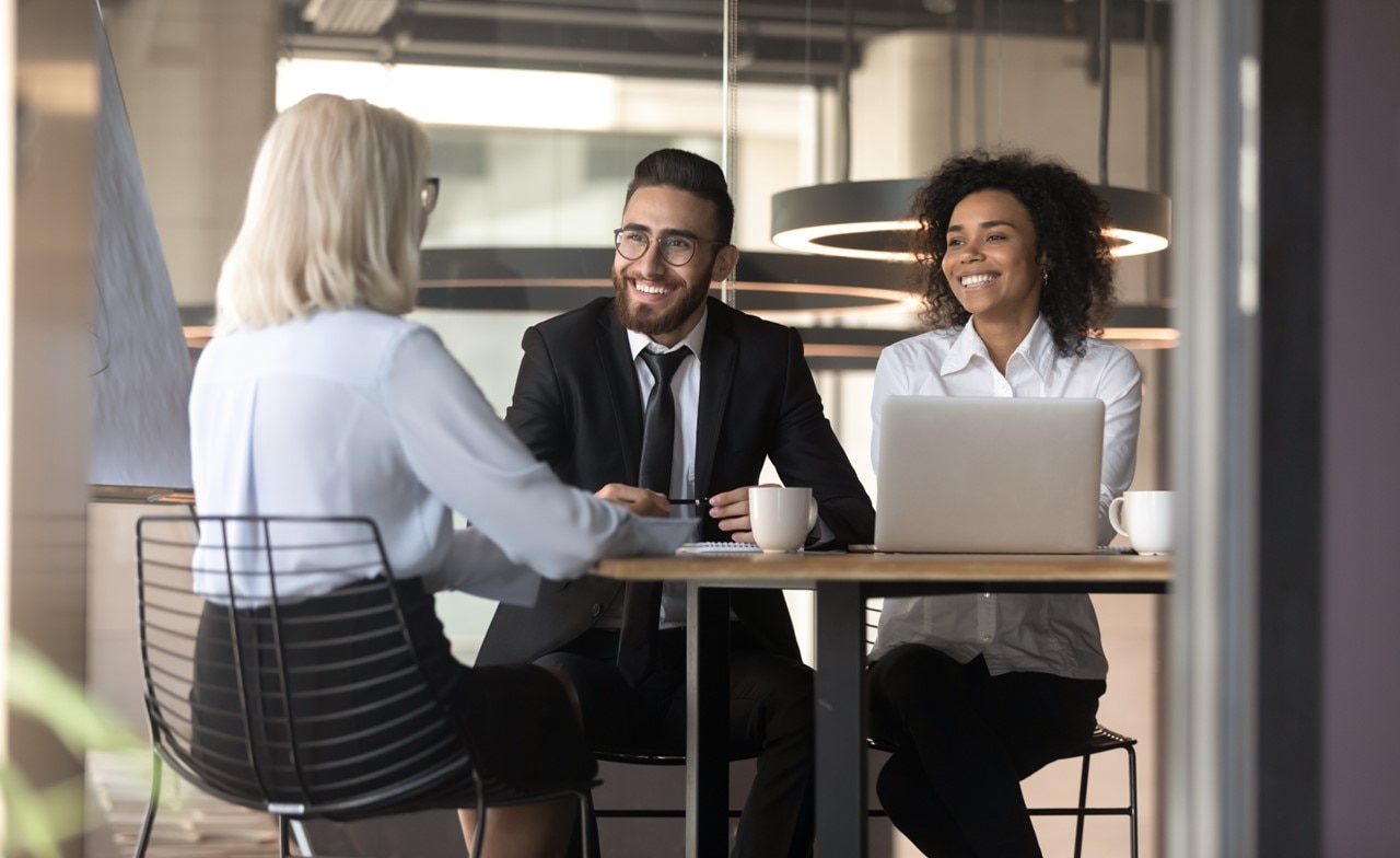 Three business consultants meeting at a table