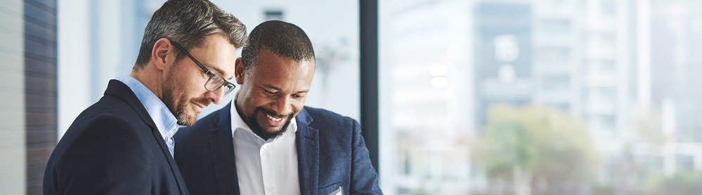 Consultants discussing cloud-proven payments solution