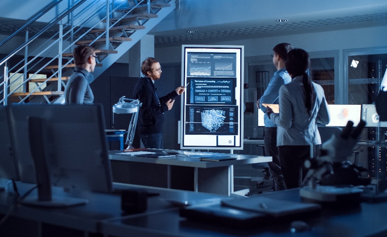 Professionals looking at data on a screen