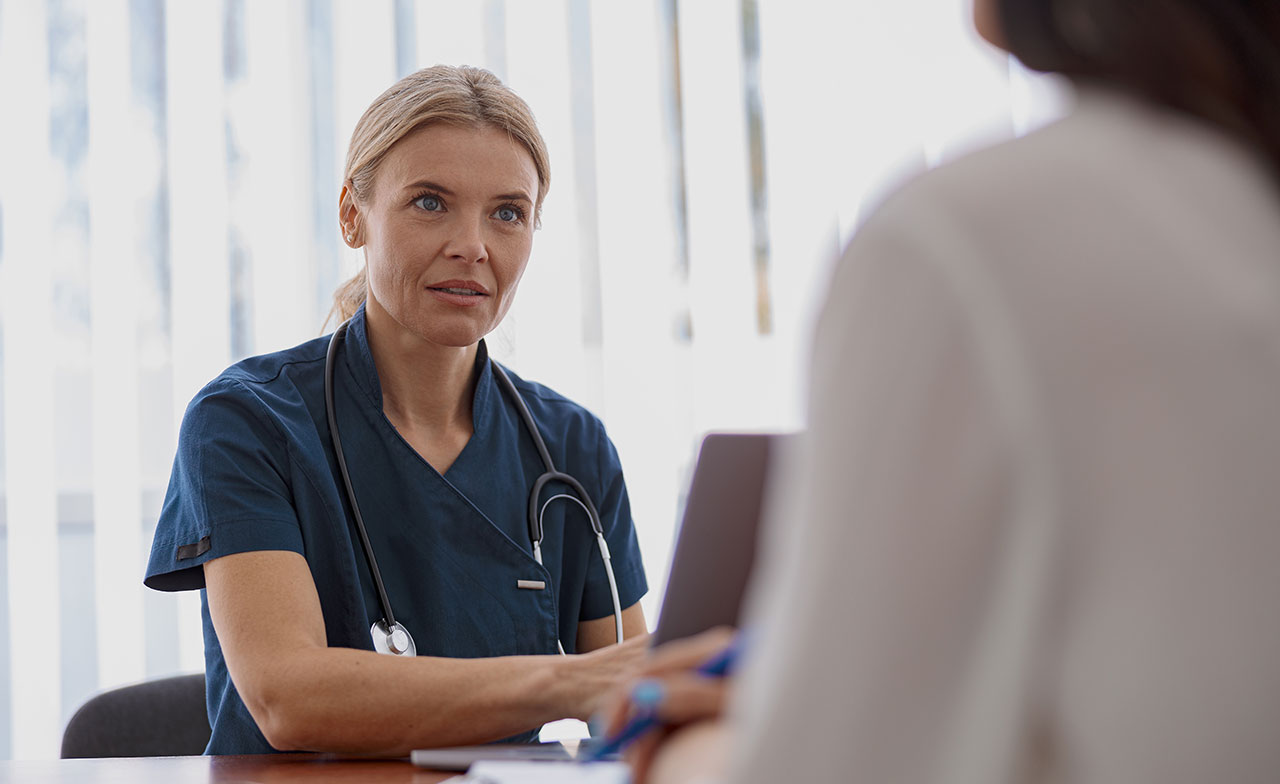  Doctor consulting a patient in an office