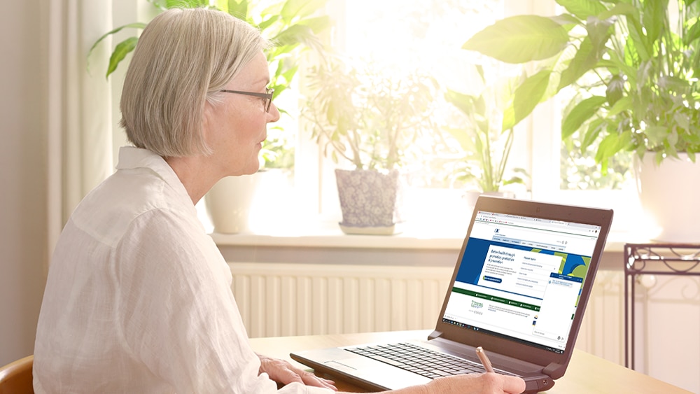 woman at laptop interacting with chatbot