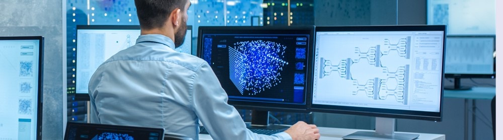 data scientist working on his computer