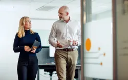 CGI partners walking and discussing managed IT services