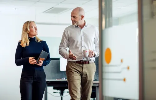 CGI partners walking and discussing managed IT services