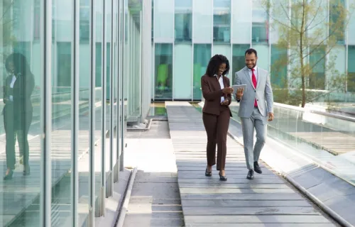 Colleagues walking and discussing privacy