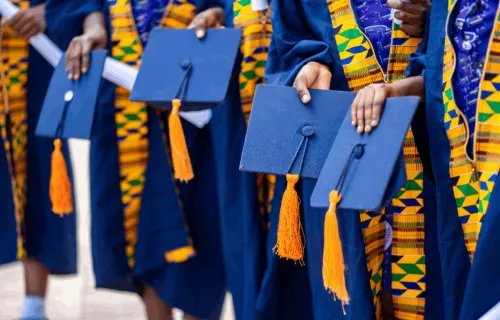Graduates wearing dark blue gowns