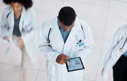 A doctor using a tablet