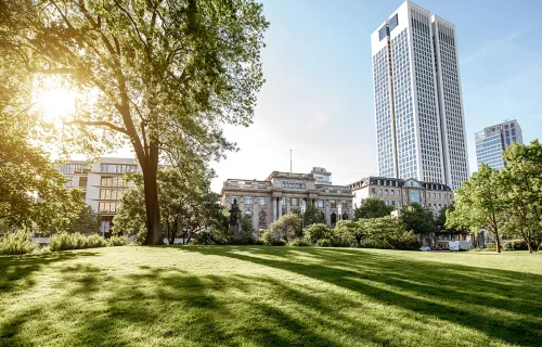 high rise building with greenery around