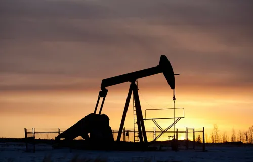 onshore oil rig at sunset