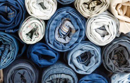 stack of different rolled jeans