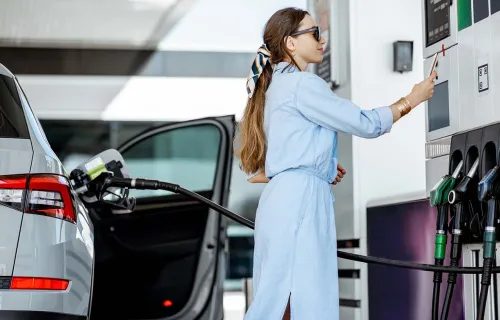 Woman filling fuel by herself