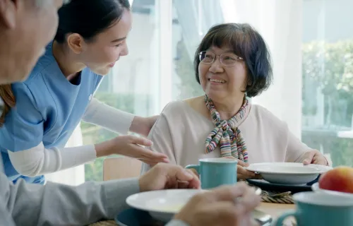 Healthcare provider assisting patients in their home